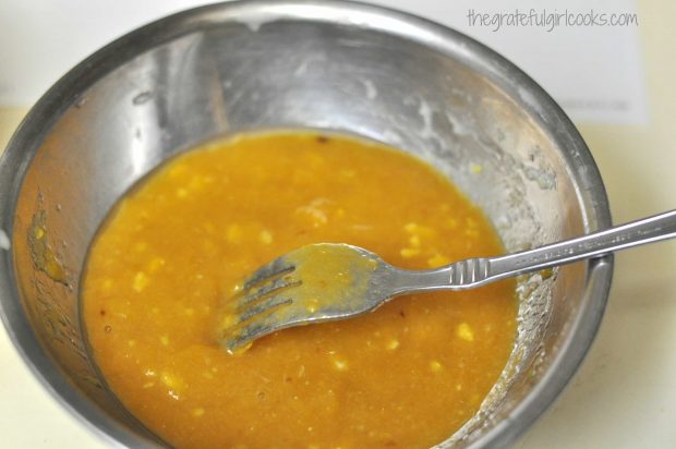 Pumpkin puree, eggs, etc. are mixed to add to pancake batter.