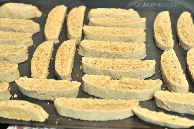 Pumpkin Spice Latte Biscotti slices are baked a second time, cut side down.