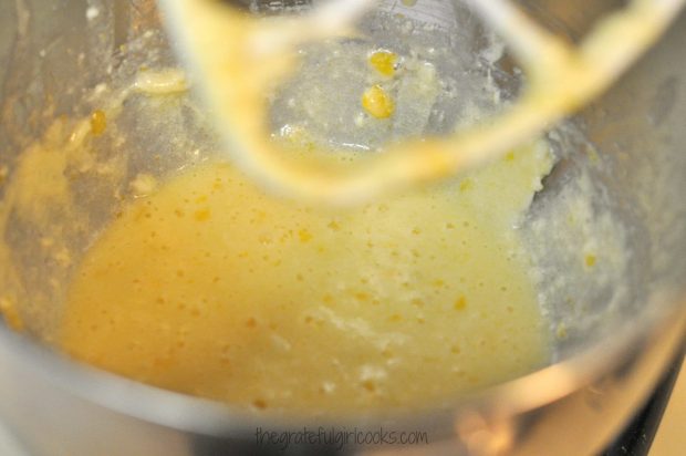 A stand mixer is used to blend butter, sugar and eggs to make biscotti batter.