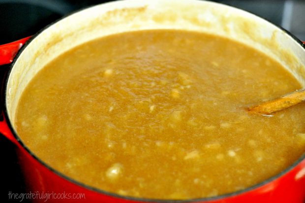 Red saucepan of apple butter cooking