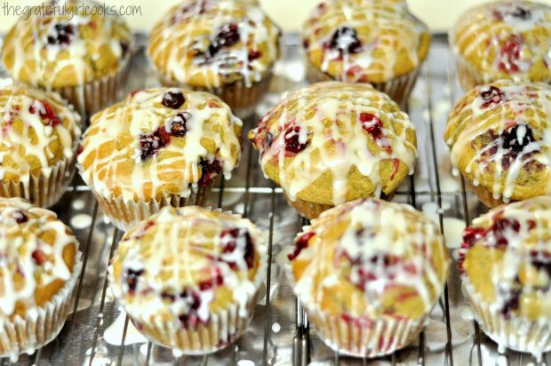 Cranberry orange muffins, drizzled with orange flavored glaze, before serving.
