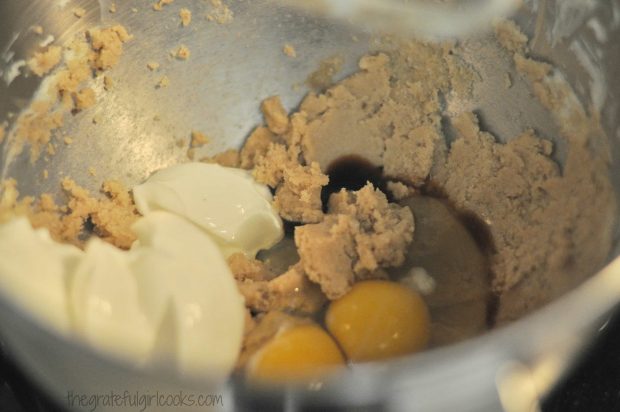 Eggs, yogurt and vanilla added to cranberry orange muffins batter