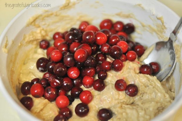 Fresh cranberries are added to orange flavored muffin batter.