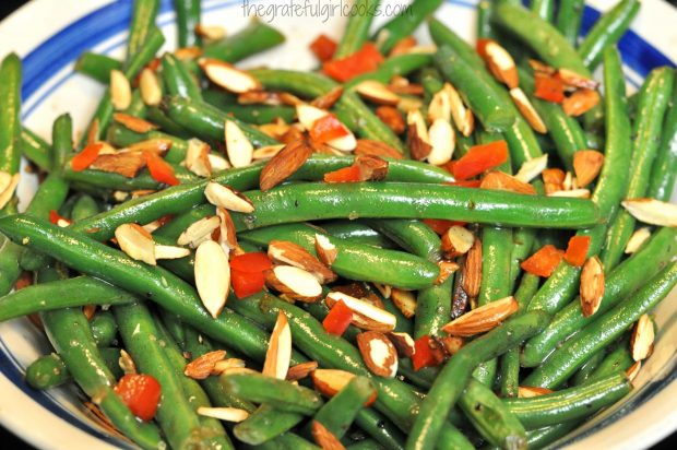 Brown Butter Green Beans with Toasted Almonds & Red Peppers are served in bowl.