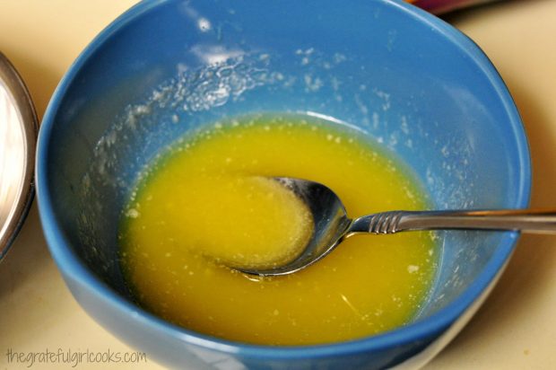 Butter is melted to make sauce for chex mix munchies.