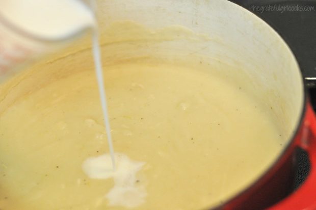 Whipping cream is added to creamy potato leek soup right before serving.