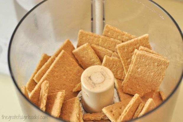 Graham crackers are pulverized into fine crumbs.
