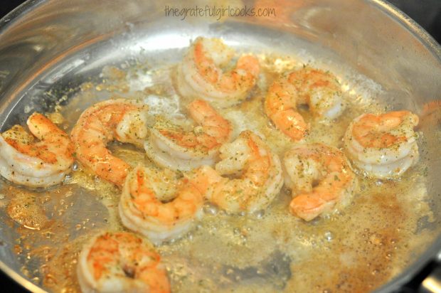 Seasoned shrimp to add to the mushroom risotto, are pan-seared in large skillet.