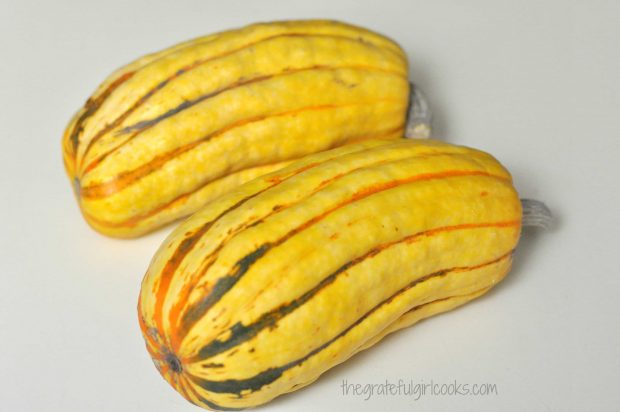 Two delicata squash are used to make roasted delicata squash.