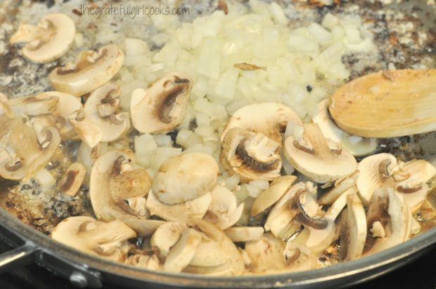 Mushrooms and onions cooking in skillet