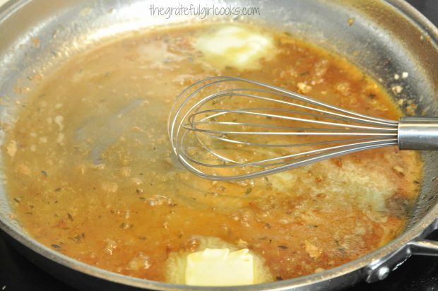 Sauce is whisked and cooked in skillet for the chicken cutlets with pecan sauce.