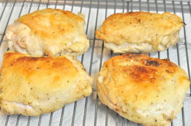 4 pan-seared chicken thighs, for chcken thigh osso bucco, on wire rack.