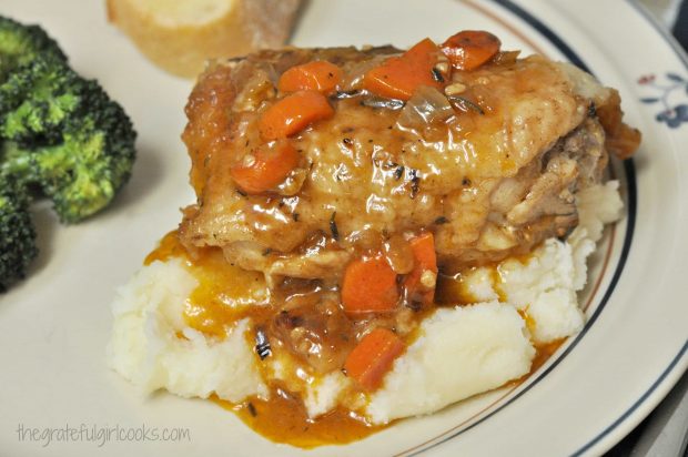 Chicken thigh osso bucco served on top of mashed potatoes.