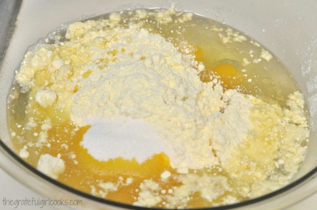 Ingredients for lemon jello cake in large bowl.
