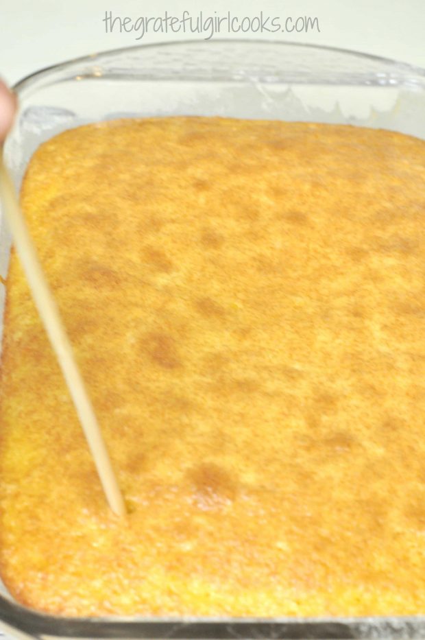 After lemon jello cake is baked, holes are poked into cake