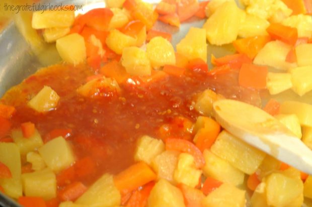 Red bell pepper, pineapple and sweet chili sauce are heated for the sweet fire chicken sauce.