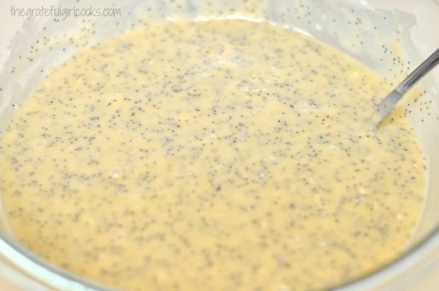 Poppyseed muffin batter in large glass mixing bowl 