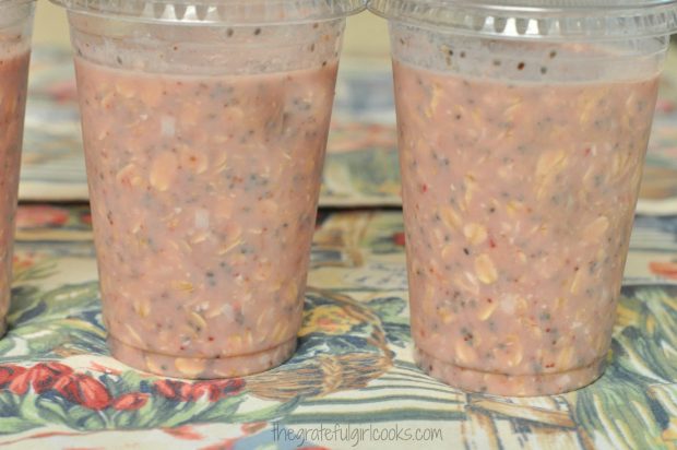 Strawberry Coconut Overnight Oats in individual covered cups are ready to enjoy.