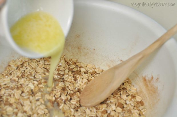 Melted butter poured into dry ingredients in bowl