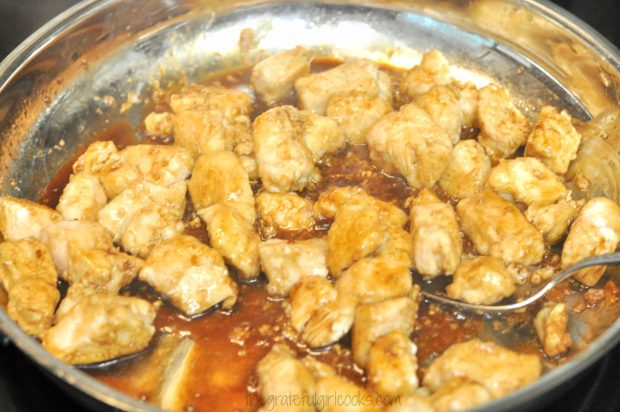 Chicken pieces are cooked in the Asian sauce for a few minutes until done.