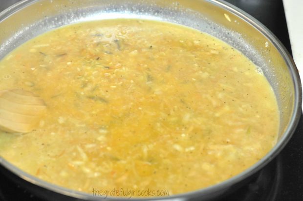 Chicken broth is added to homemade rice pilaf, then cooked.