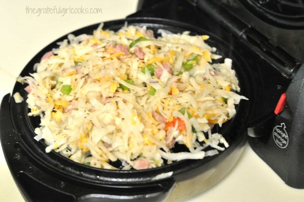 Loaded Hash Browns - Waffle Style are placed into preheated waffle iron.