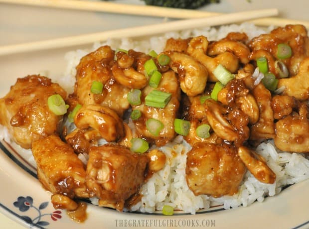 Easy cashew chicken is ready to eat, on a bed of white rice!