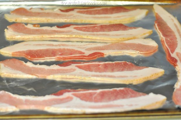 Individual slices are placed on an aluminum foil covered baking sheet.