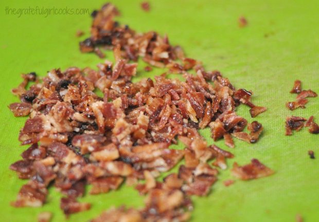Chopped, candied bacon for ice cream, on green cutting board