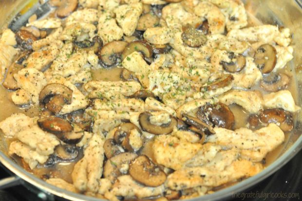 The Chicken Marsala is sprinkled with parsley before serving.