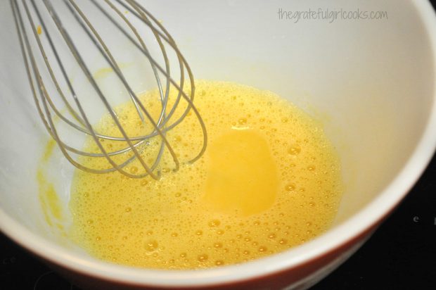 Ingredients for homemade mayonnaise are whisked until fully blended.