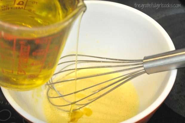 Light olive oil is added to egg mixture while whisking continuously.
