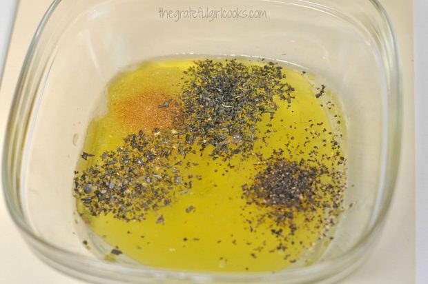 Olive oil and herbs are used to make pork chop marinade.