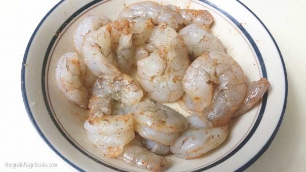 Shrimp are peeled and de-veined, then lightly seasoned before cooking.