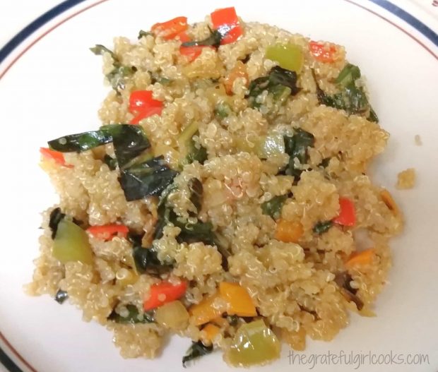 Veggies and quinoa are mixed together in bowl.