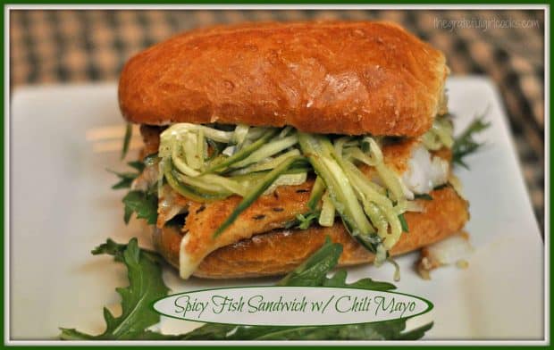 Spicy Fish Sandwich with Chili Mayo is an incredible meal, featuring pan-seared cod, peppery arugula and marinated cucumber strips, served on a toasted roll!