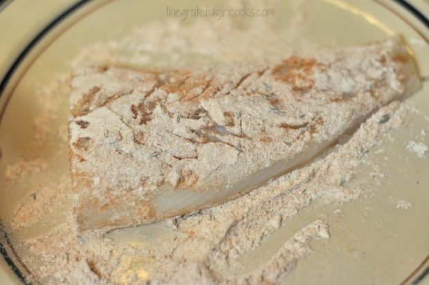 Cod fillets are dredged in flour/spice mixture before cooking