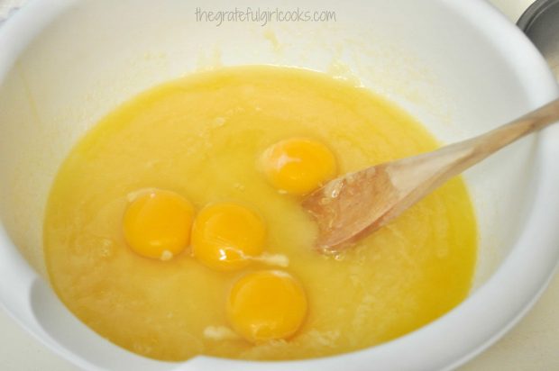 Eggs, sugar, vanilla in bowl to begin making batter for brownies.