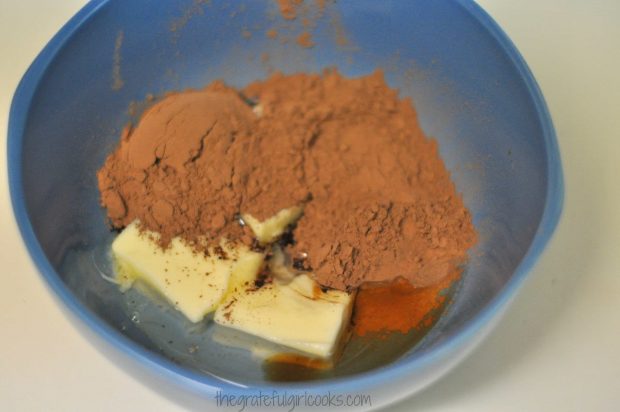 Frosting ingredients for JB's best brownies in a small blue bowl.