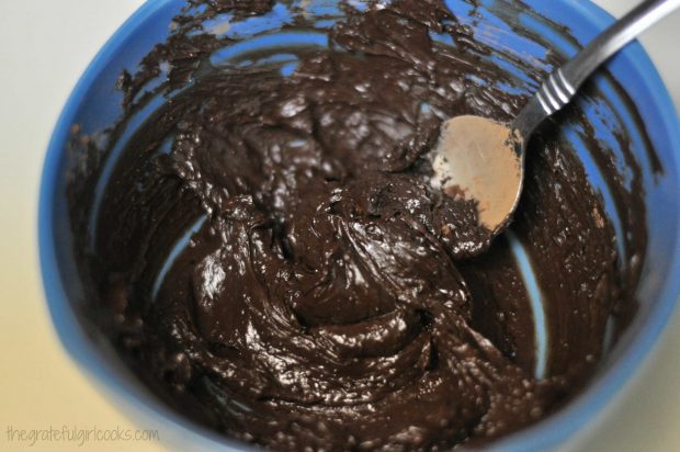 A thick chocolate frosting for the brownies is mixed together easily.