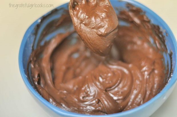 Powdered sugar is added to frosting for JB's best brownies, until smooth and creamy.