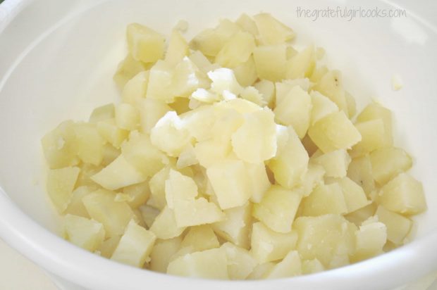 Potatoes cut into cube shapes for potato salad.