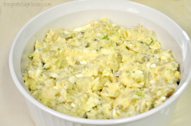 Potato salad in white serving bowl.