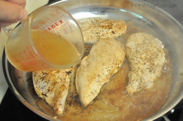 Chicken broth is added to the skillet Monterey chicken while it cooks.