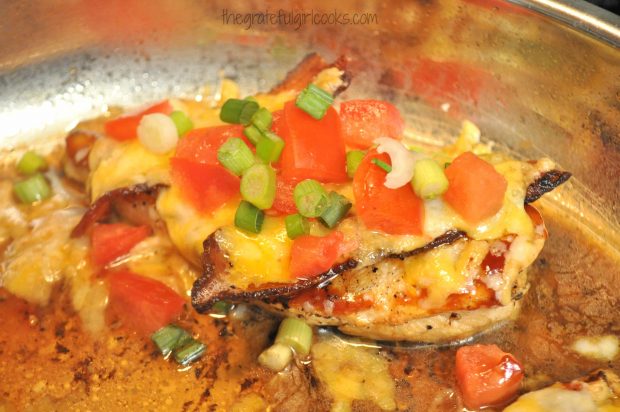 Chopped tomatoes and green onions are added to top the skillet Monterey chicken.