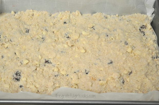 Crumb mixture spread over blackberry pie filling before baking