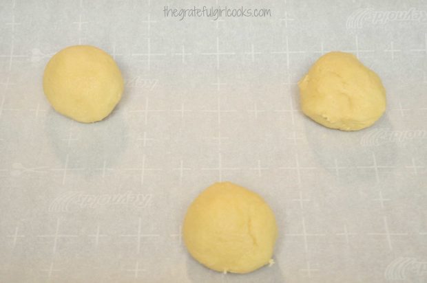 Giant Sugar Cookie dough is placed onto parchment paper before baking.