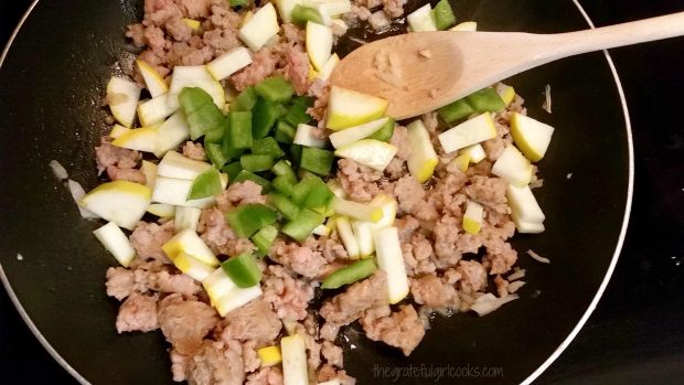 The ingredients for the pasta "sauce" are cooked in a skillet.