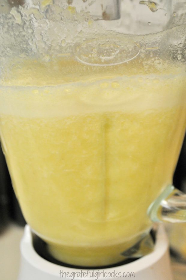 Pineapple chunks and fresh lime juice are fully blended.