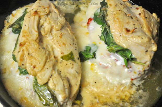 After baking the stuffed chicken breasts are browned, and oozing with melted cheese.